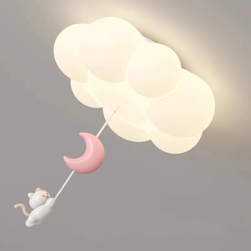 Kitten Hanging From Cloud Ceiling Light